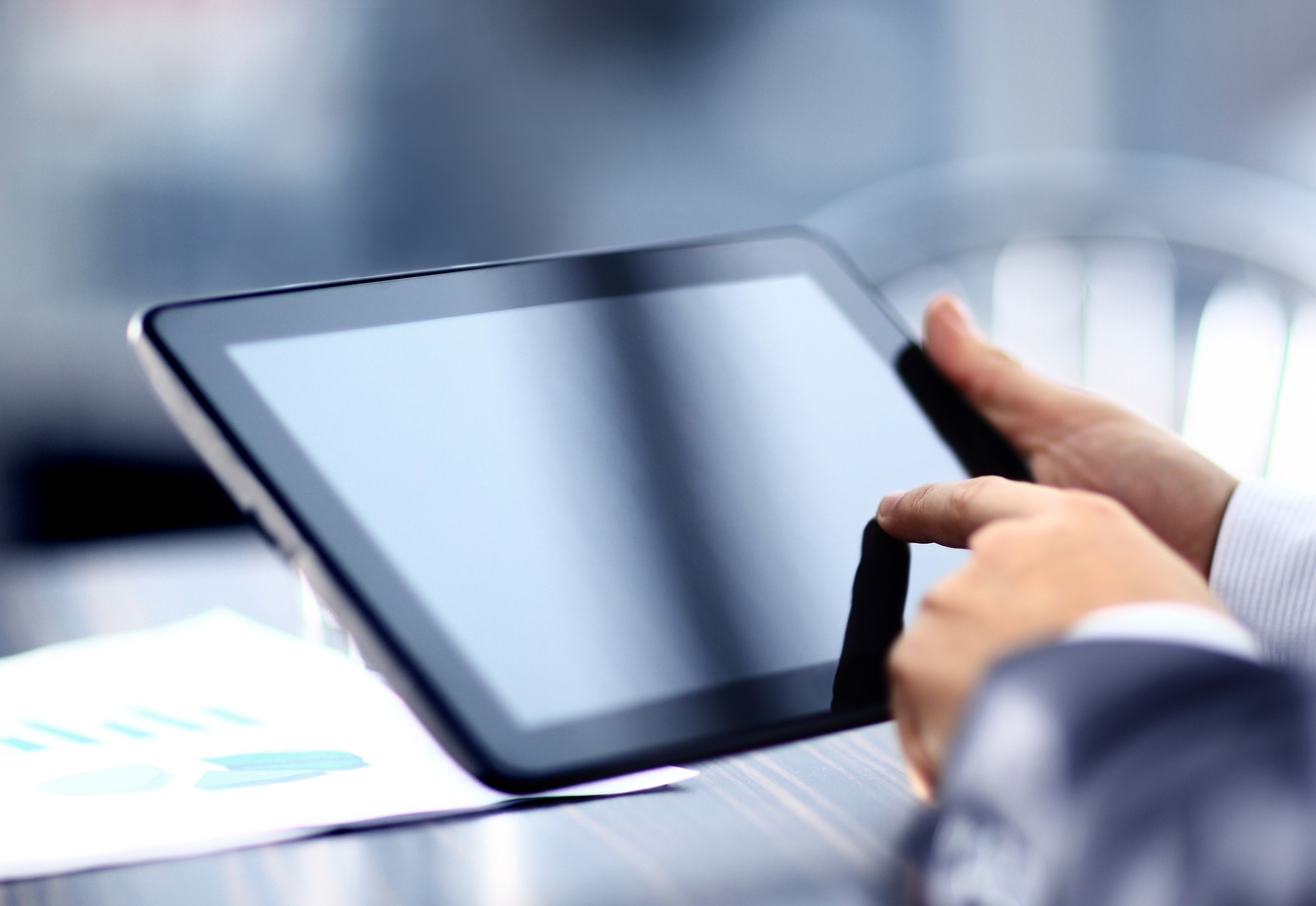 Teacher holding digital tablet